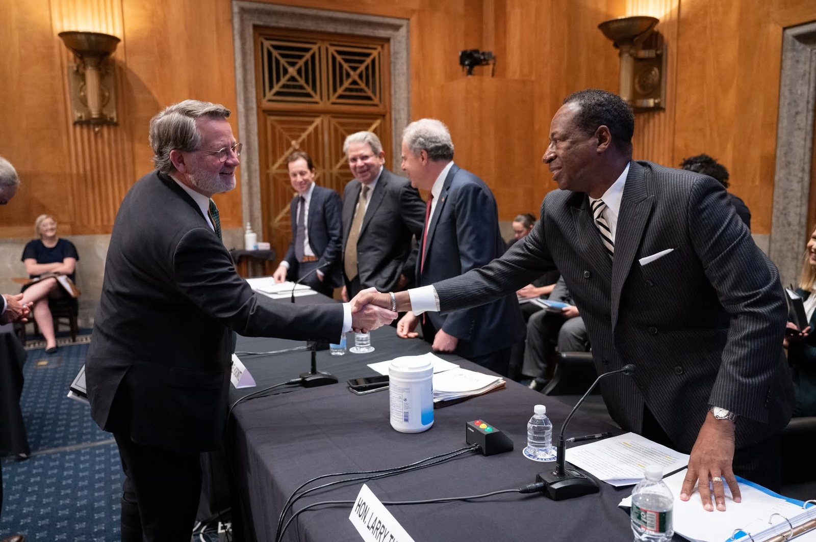 Larry D. Turner greeting a Senator before a hearing